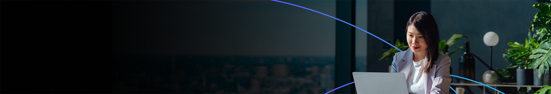 Woman working on a laptop in a modern office