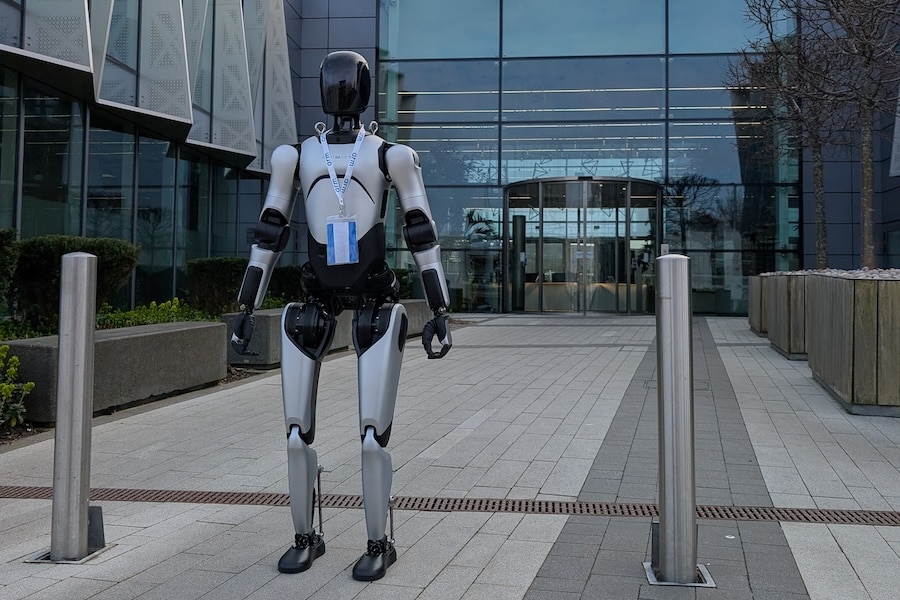AGIBOT A2 model wear landyard standing image at outside of Arm Headquarter in Cambridge