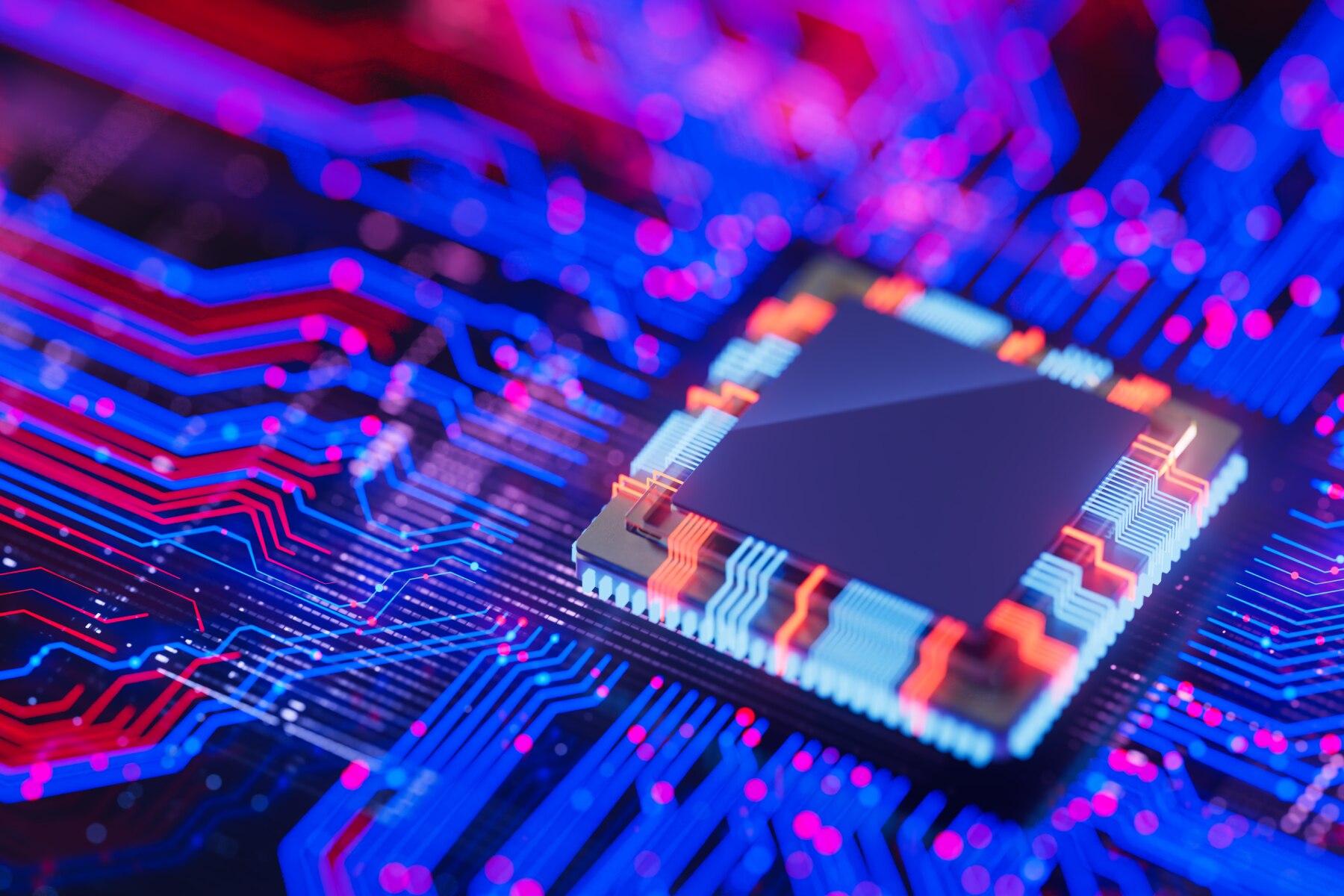Close-up of a glowing microchip on a vibrant blue and red circuit board symbolizing advanced computing power.