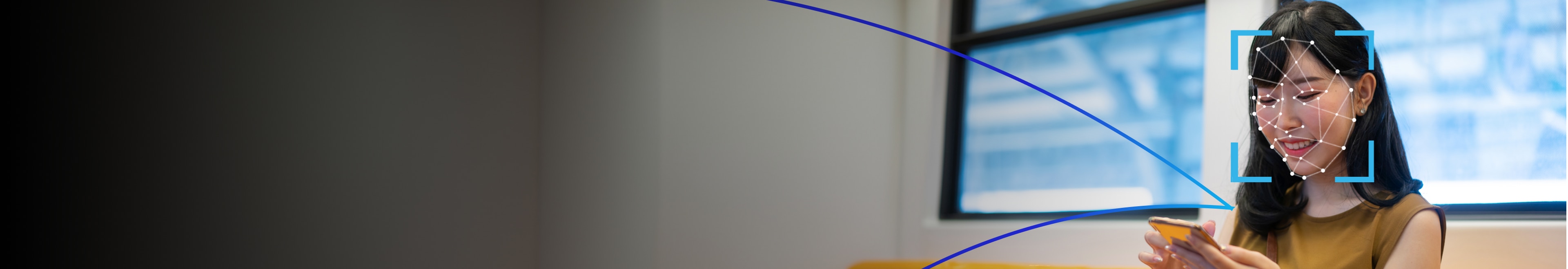 Facial recognition on woman with smartphone