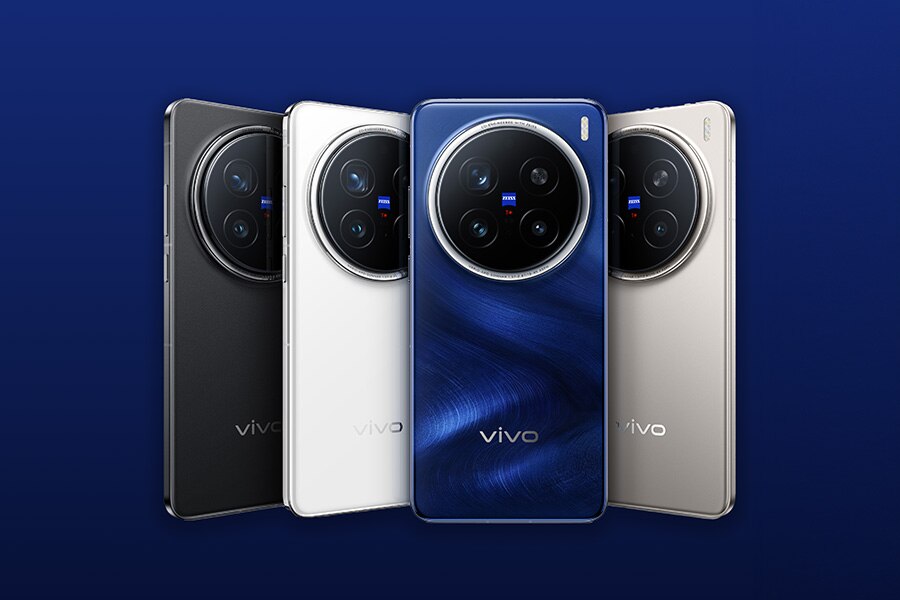 Four Vivo smartphones in different colors displayed against a blue background.