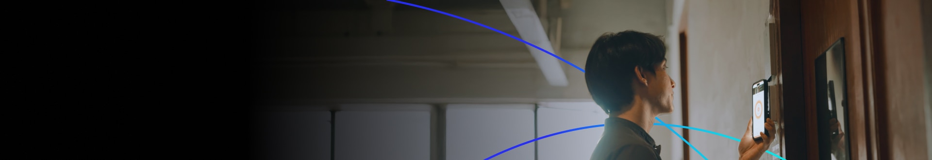 Person using a smartphone for keyless entry at a smart lock system.