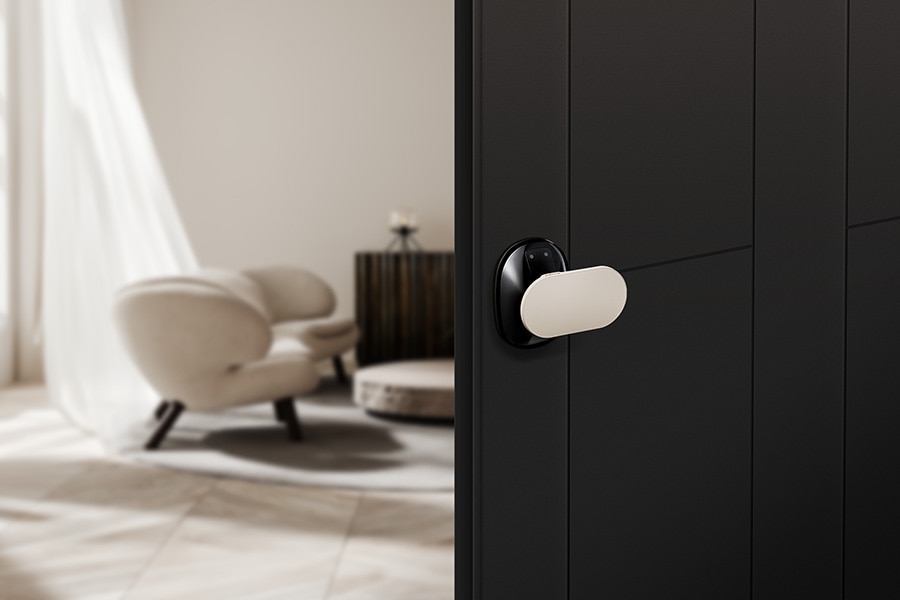 Person using a smartphone for keyless entry at a smart lock system.