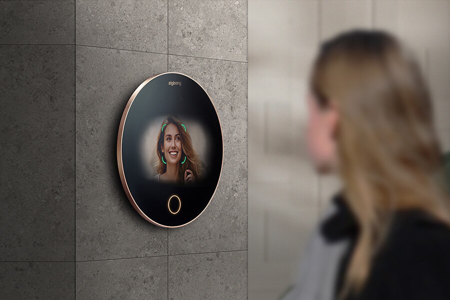 Hand pressing a fingerprint scanner on a smart lock keypad.