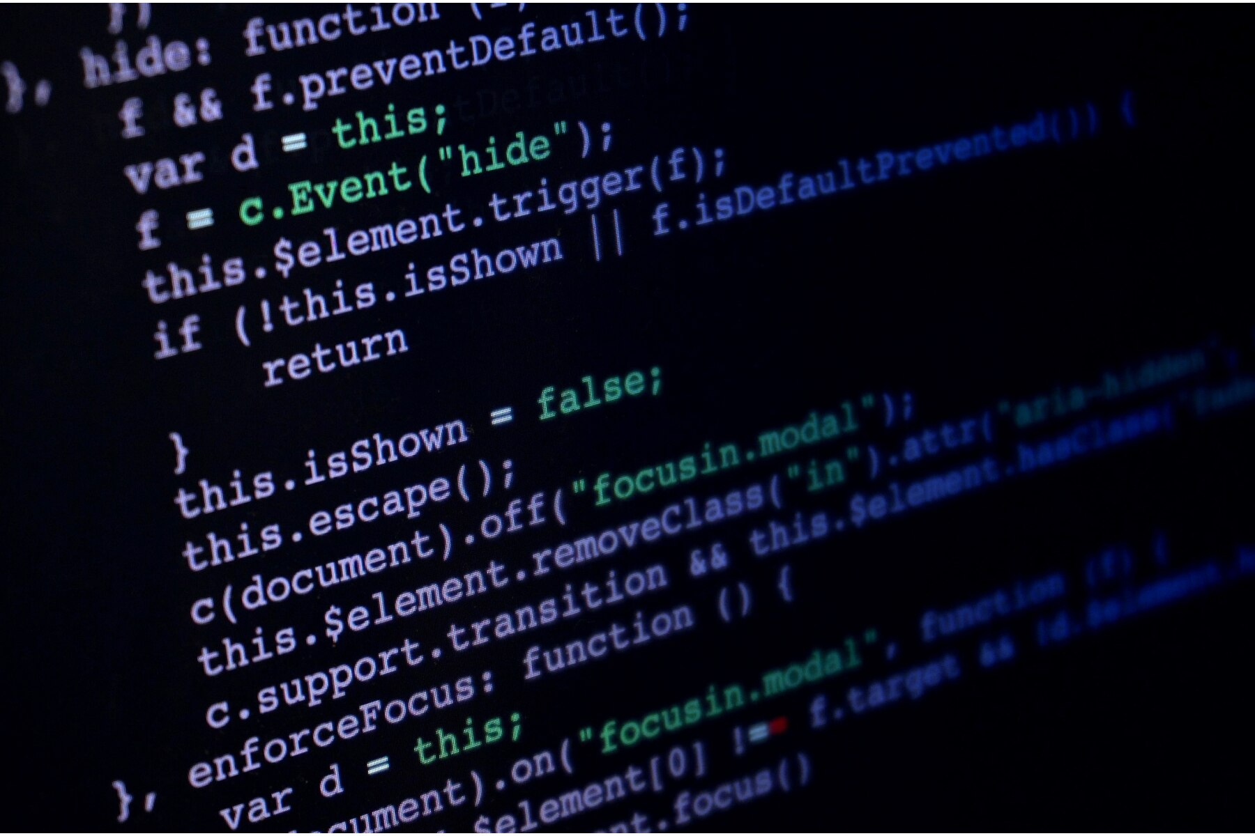 JavaScript programming code displayed on dark computer screen for web development.