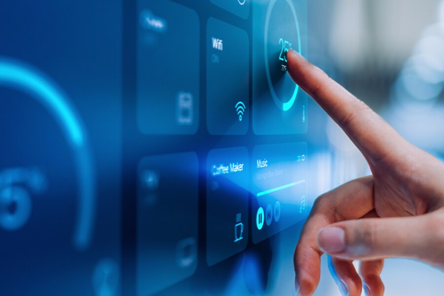 Close-up of a hand interacting with a smart touchscreen interface.