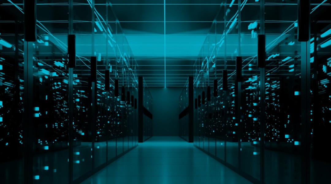 Futuristic data center hallway glowing with blue digital light.