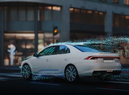 Autonomous vehicle driving through a city with visualized data flow around the car.