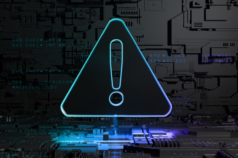 Arm technology concept image featuring a warning triangle with exclamation mark on a circuit board, representing risk reduction, threat detection, and security mitigation.