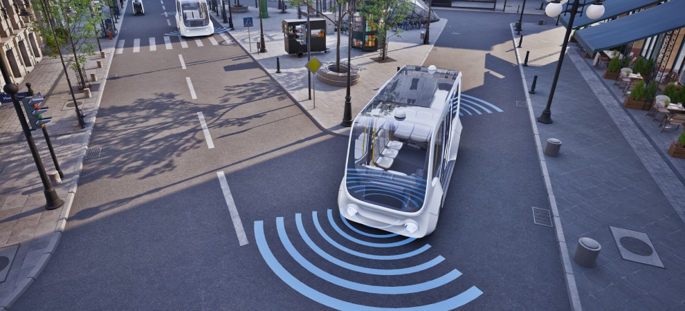 Autonomous shuttle with sensor signals on a city street.