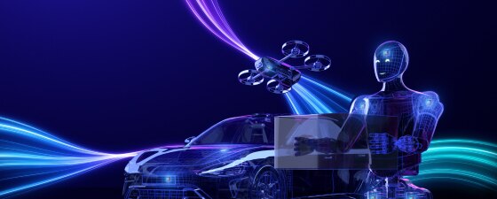 Futuristic humanoid robot using a laptop beside a car and drone, surrounded by glowing blue and purple light trails.